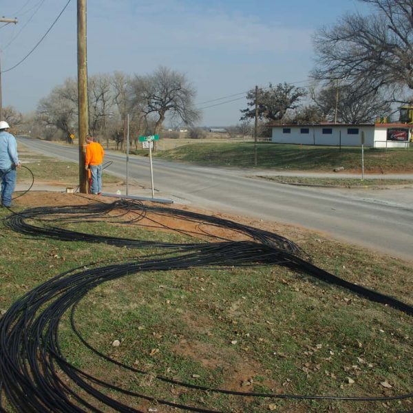 These huge lengths of fiber optic cable lay on the ground in a giant "figure-8" pattern as our contractors prepare to pull them into a conduit under the highway.