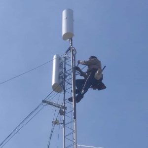 Tower climber Leonard Smith installs some cabling to the radios on top of our new tower south of Fort Cobb Lake